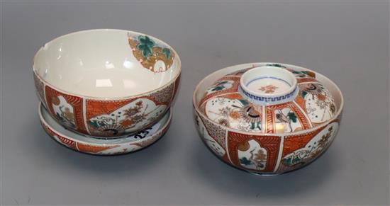 A pair of Imari bowls and covers